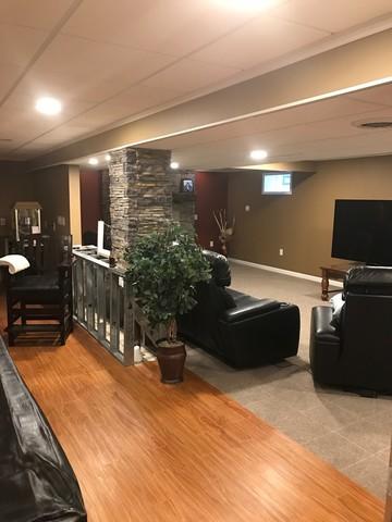 Finished basement with a home theater and a play area