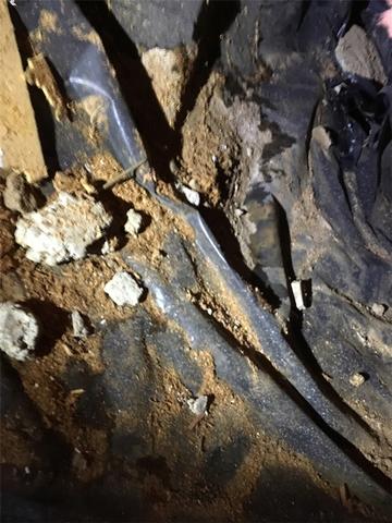 This crawlspace is in need of a serious clean up!