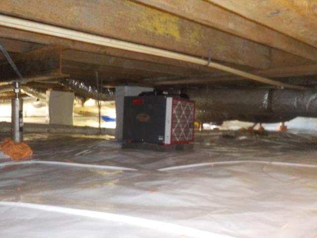 Dehumidifier controls crawl space humidity