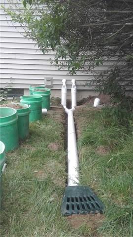 By extending the discharge line away from the house and working with the grade of the lawn, we can make sure water doesn't just run right back into the foundation.