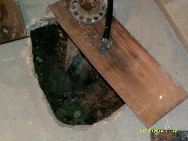 Old Sump Pump hole in Greenwich, CT Basement