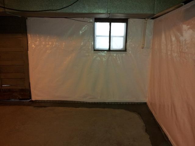 We install this nice looking white reinforced plastic on the walls, and actually run it into the drainage system. It is sealed at the top, and has a anti-microbial product built right into it so mold cannot grow between the wall and product.