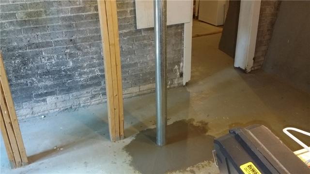 Once the SmartJack is in place, the concrete is replaced over top of the base plate, creating a continuous floor again.