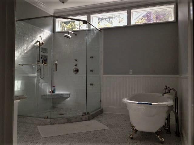 An enormous shower with a clawfoot tub.