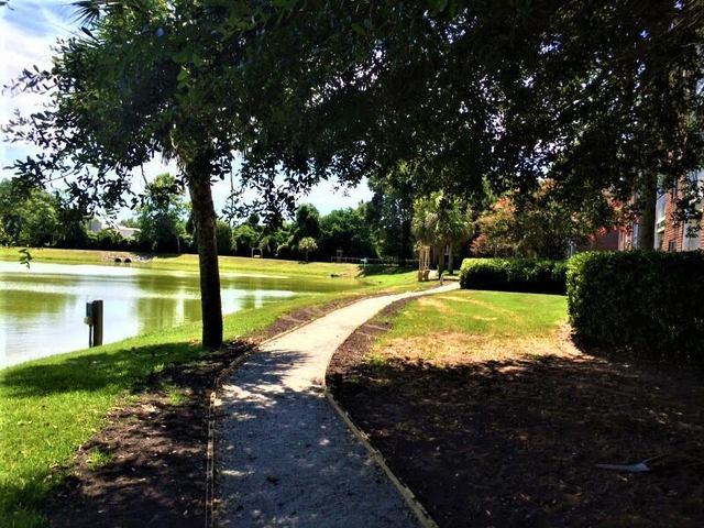 Take a stroll next to a pond on this pathway.