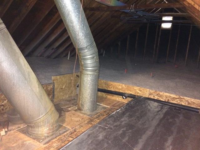 The large cavity pictured before that is allowing air to move throughout the framing of the house has now been air sealed properly and allows no air to move through it.