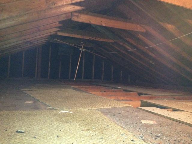 Shows the end of the attic and the makeshift storage deck.