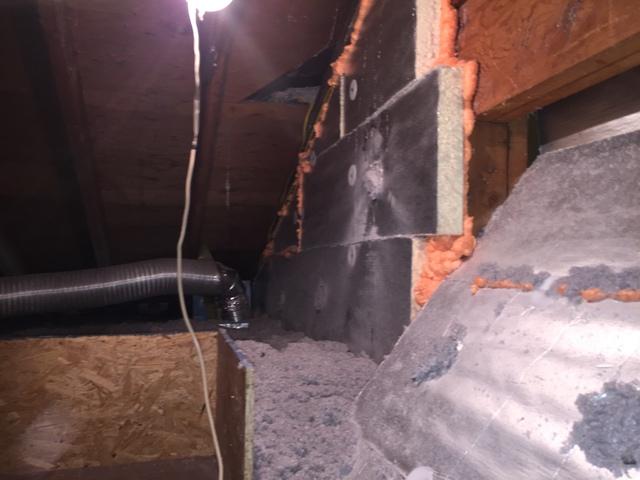 Kneewall and Stairwell covered with foam board and air sealed to ensure the second floor is insulated from the adjacent attic.