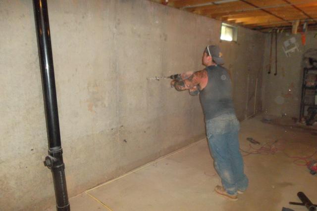 <p>Holes are drilled into the foundation wall</p>