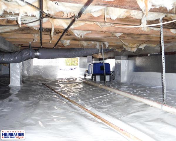 By installing the SaniDry Dehumidifier System we can extract water from the conditioned air of the crawl space.