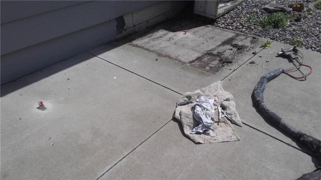 Before PolyLEVEL foam application to raise patio in Dexter, MN