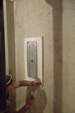 <p>Installation of <a href="https://www.suredrybasements.com/foundation-repair-wisconsin/foundation-repair-products/foundation-wall-repair.html">wall anchor</a> covers</p>