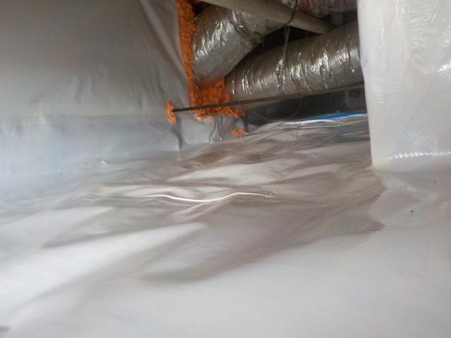 Block walls are porous, allowing air to flow through inside the crawlspace. The CleanSpace liner is a 7 layer material that seals out water vapor. Pipes and wires have a generous amount of caulking applied to ensure that there are no holes or gaps in the liner.