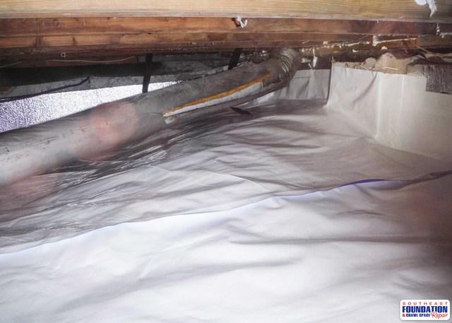 The walls of the crawl space is lined with the CleanSpace Liner to prevent water from entering the crawl space from the foundation walls.