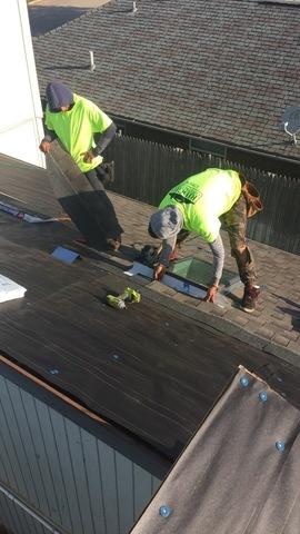 Crew at work Installing a new roof and skylight