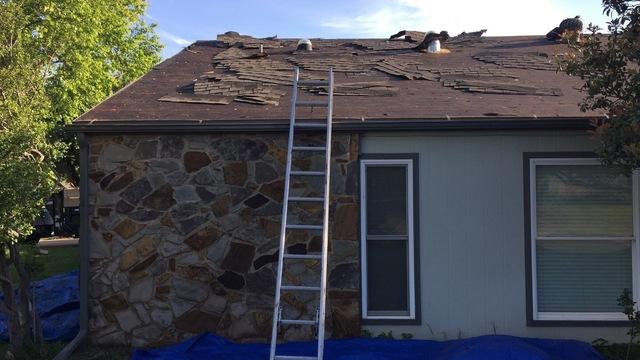 Tearing off the old shingles to inspect decking and re-roof.