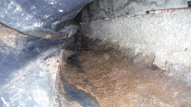 Water coming in under the footing
