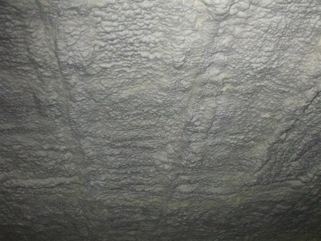 This is a photo of a larger section of the attic ceiling that has been foamed.