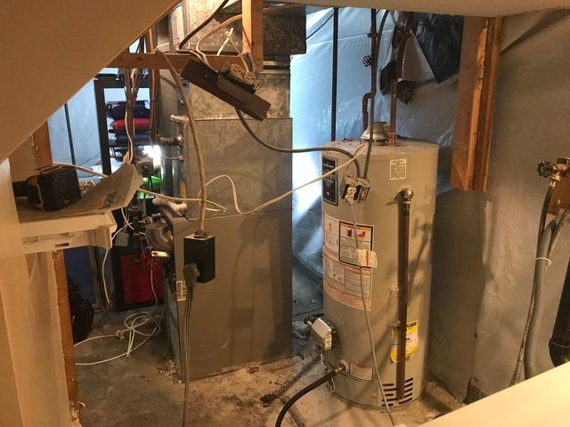 The old water heater was also connected to the crumbling chimney and was only 54% efficient.