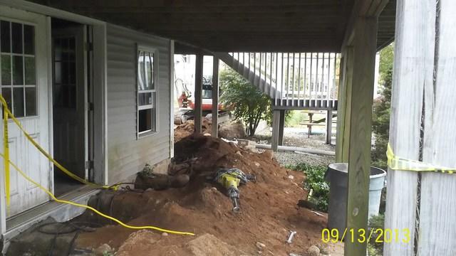 <p>The area under the deck needed to be dug up by hand for the push piers to be installed.</p>