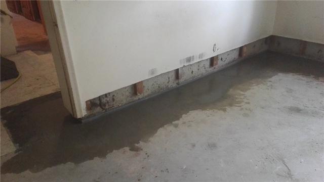 Once everything is in place, we pour new concrete to restore the floor. Once it dries, it will be almost indistinguishable from the original concrete.