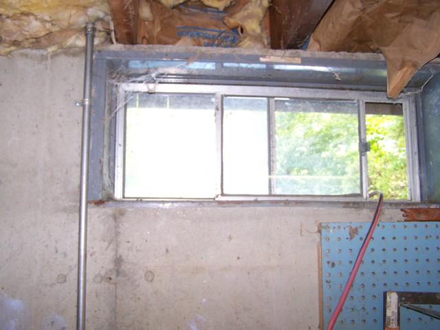 <p>For many years, builders have been in the habit of installing inexpensive steel-framed windows in basements, like the one in this Bethany, CT home. While this strategy certainly saved money, it also resulted in problems for homeowners.</p>