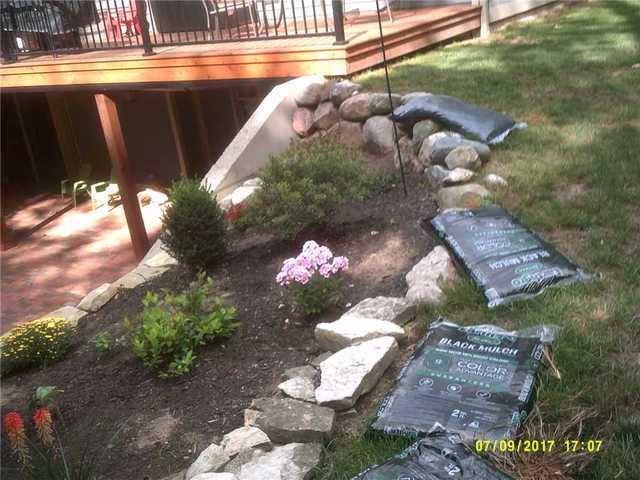 As soil shifts from frost heave, wash out, and any other number of causes, it can put pressure on anything in its way - sometimes the walls of a foundation, and sometimes a retaining wall like this one.