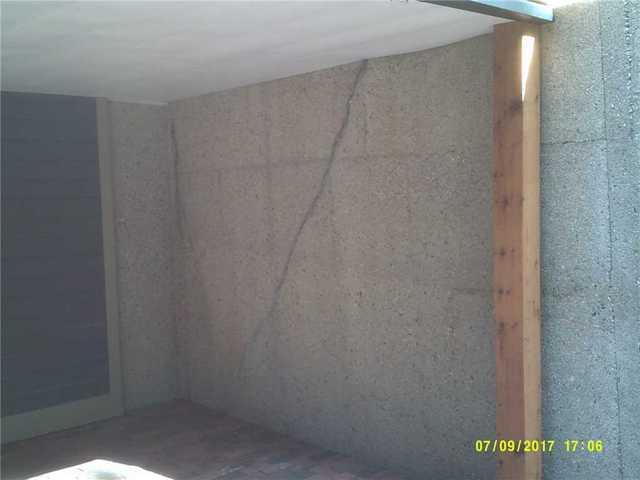 Pressure from shifting soil causes walls to bow, and when they bow far enough, concrete can crack and the structure of the wall can be compromised.