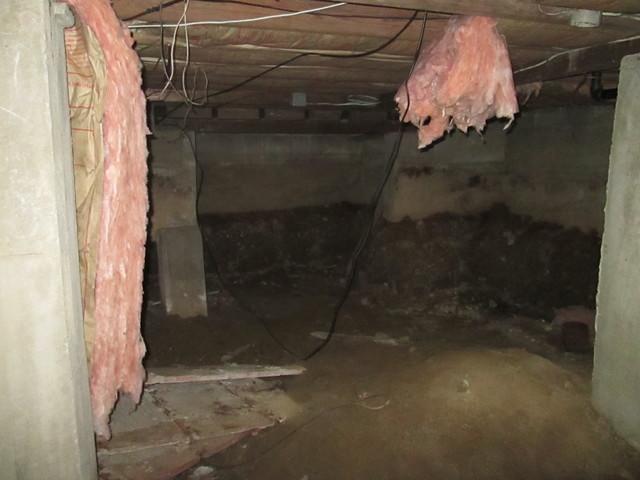 <p>Melting snow in Brooklyn, CT flooded this crawlspace, causing massive damage. We installed the WaterGuard drainage system, which is resistant to clogs, has easy-to-access service ports, and the ability to collect leaking water from the basement walls.</p>