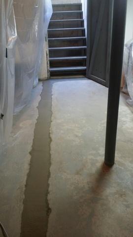 The WaterGuard System is fully installed and is under the wet cement. This system is internally placed and it collects and channels water before it even enters the basement. The water is then lead to a sump pump.