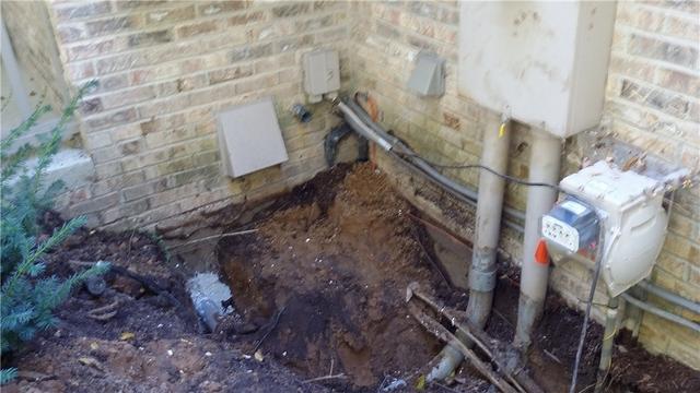 Hand-Digging Around Electrical And Gas Lines