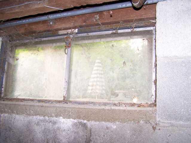 <p>The outdated window in the basement of this home in Easton, CT has a rusting steel frame. It is not only ugly, but also inefficient with air and water leaks. We replaced it with our EverLast&reg; Basement Windows, framed entirely with vinyl, so they will never rot or rust. The windows are double paneled and made with low-e glass that keeps the basement cool in the summer and warm in the winter. The new windows give the basement a clean appearance and greatly reduce leaking.</p>