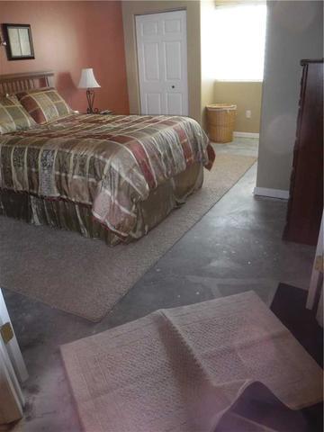 The homeowner had pulled up the carpet and attempted to seal the cracks in the floor but the water was still an issue.