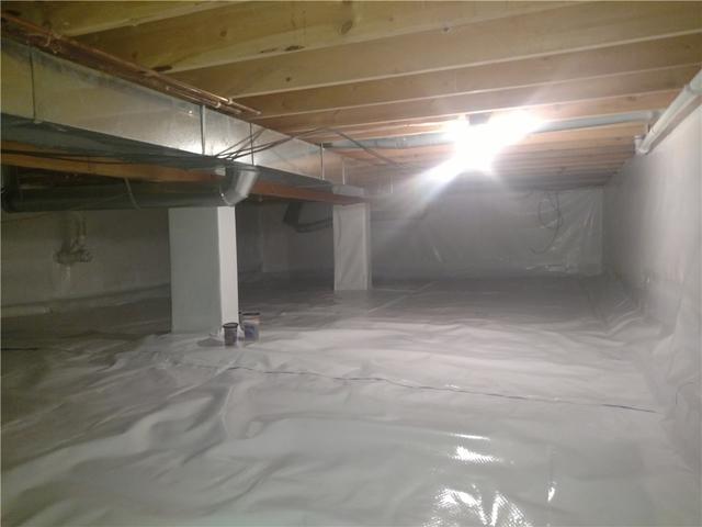 The crawl space wasn't all that intimidating to look at in the first place but the finished space is just clean, bright, dry, and not at all an intimidating space. Our CleanSpace Material is seamlessly installed throughout and is even wrapped around the piers to create one complete moisture barrier.