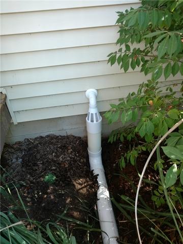 An IceGuard fixture next to the home provides an escape for moisture during the cold winter months in the event that the discharge line becomes frozen and blocked up. Without the IceGuard fixture incoming moisture would back-up into the crawl space rather than being pumped out.