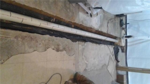 Moisture coming up through floor cracks won't always be stopped by a perimeter system. In this case, we incorporate a cross tile under the basement floor to capture that moisture and direct it to the sump pump before it can make its way into the living area.