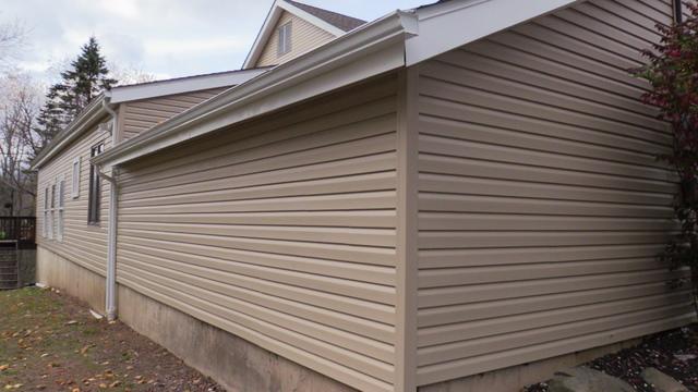 Check out the corner of this freshly sided home in Bartonsville, Pennsylvania, along with the new gutter, fascia, and soffit installed with premium quality