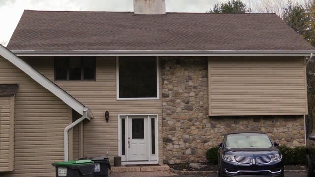 The front of the home looks incredible surrounded by new siding, fascia, and soffits, and topped off with a brand new roof to protect all from above