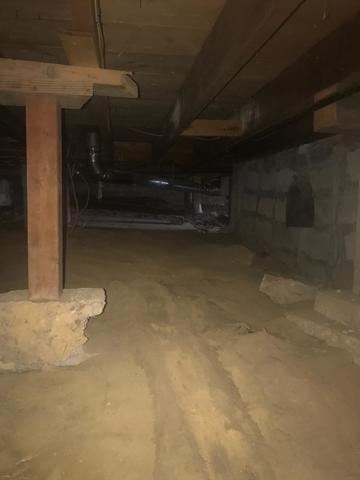 The block foundation is porous and allows water and moisture into the crawlspace