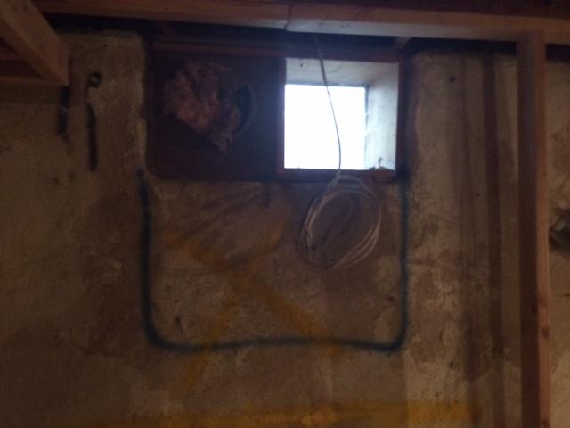 One of the first steps of installing an egress window is to outline the proposed window size to get a better idea of the placement. In this case, there was an existing basement window so the placement was staying the same, but the window size would be larger.