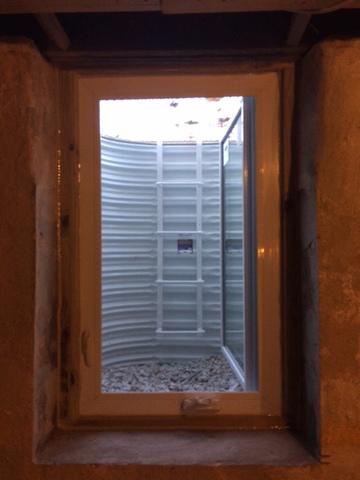 The owners of this house in Plymouth Meeting, PA wanted to add a safe escape from their old basement. We installed an egress window in their old stone foundation and they were happy with the result. There is also a ladder to provide safe, easy egress.