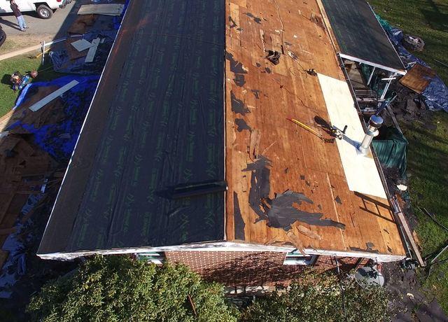 This roof is in a couple varying stages as you can see from left to right, and Pinnacle Exteriors is going to leave it leak free and with a home lifetime warranty, as well.