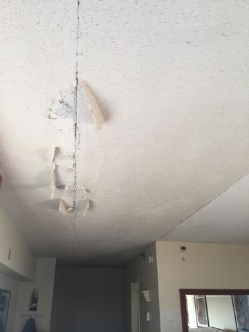 Before removal of damaged popcorn ceiling