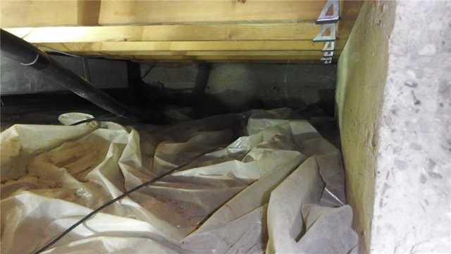 Crawl Space with Ineffective Tarps Can Hold Water
