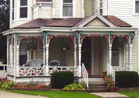 Victorian home front porch with accent colors