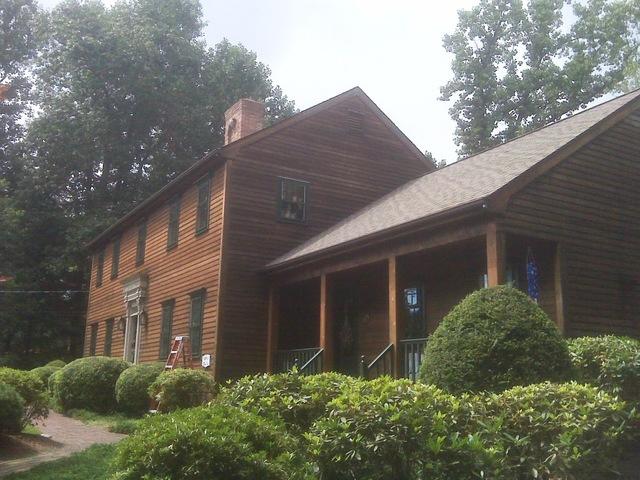 Stained house with painted trim