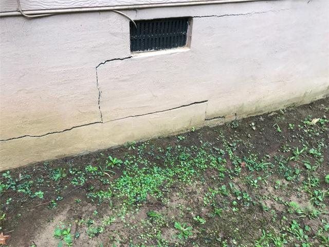 <p>This homeowner first noticed that there was a problem with his home's foundation by the large cracks on the exterior of the home. Cracks often start from the corner of windows or vents and stair-step towards the ground. </p>