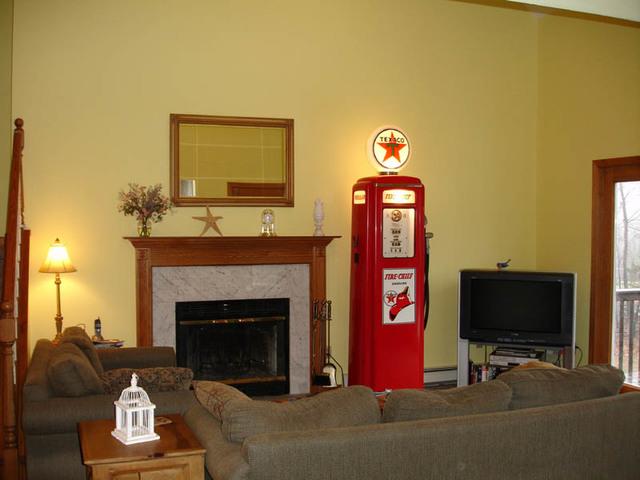 After: View of painted living room over fireplace