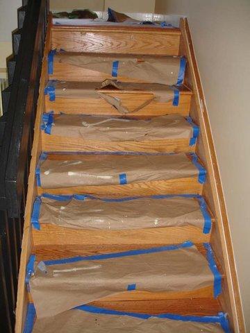 <p>Scholar painter taped off interior stairs before applying paint.</p>