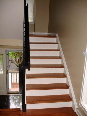 <p>You can see the impact the painted back side of the stairs has on this area in the home. Creates nice contrast between the wood floors and steps.</p>